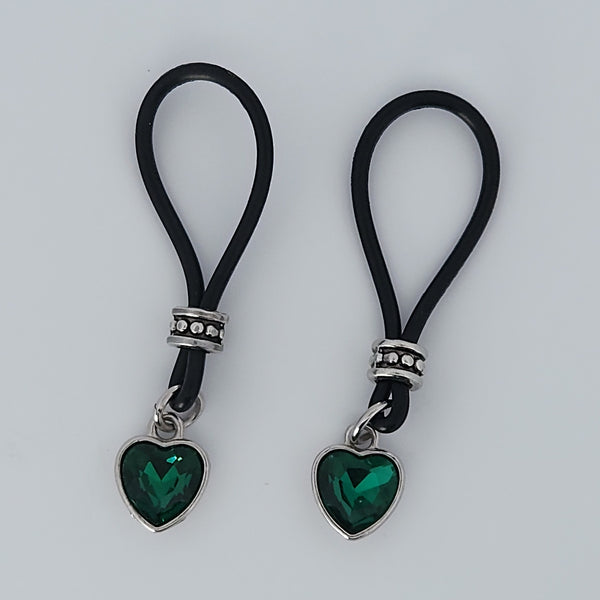 Two Rich Green Heart Shaped Gem Stone Nipple Nooses Against a White Background